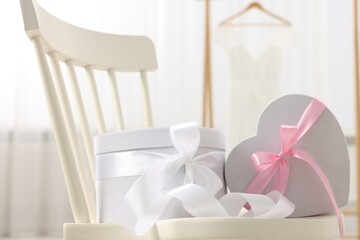 Wall Mural - Gift boxes for wedding day on chair indoors