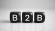 © Media Srock - Three black dice spell out business to business acronym
