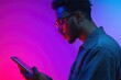 © Alla - A person looking at their mobile device with glasses