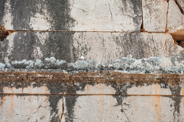 Wall Mural - Ancient wall background with old concrete bricks