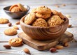 © Sirinporn - Delicious Almond Cookies in Wooden Bowl –  White Background Stock Photo