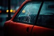 © Konstiantyn Zap - Damaged car window with broken glass on rainy evening in urban setting
