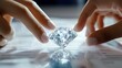 © BerkahStock - Close-up of two hands gently holding a large, brilliant-cut diamond on a document.