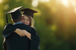 © Mselected - Graduation celebration with a proud father and his daughter embracing outdoors