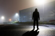 © Dave - A sinister hooded figure, silhouetted by street lights on an empty industrial estate on a mysterious foggy night