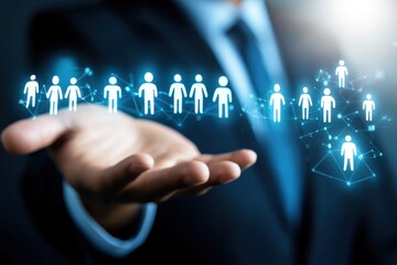 Wall Mural - businessman holding holographic icons of people in network connections demonstrating collaboration a