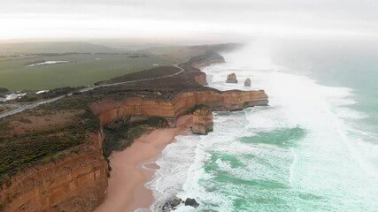 Canvas Print - Aerial view of Twelve Apostles from drone, Australia. Collection of limestone stacks. Slow motion