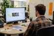 © phy - A modern workspace with a young man attending a video call, a whiteboard in the background.