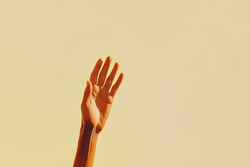 Wall Mural - Hand reaching upward with fingers extended against a yellow background