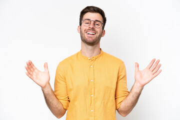 Young caucasian man isolated on white background smiling a lot