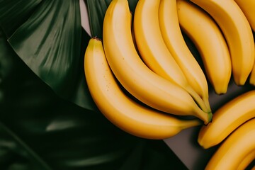 Wall Mural - Freshly harvested bananas arranged on lush green leaves, showcasing vibrant colors and natural beauty