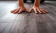 © FrameShift - Hands Installing Flexible Vinyl Flooring with Wood Texture