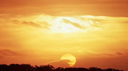 Wall Mural - Time lapse footage capturing breathtaking sunrise where golden sunlight pierces red orange clouds revealing colorful sky backdrop close mid shot perspectives ProRes quality