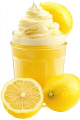 Wall Mural - A jar of whipped cream sits next to two lemons on a surface, ready for use in baking or as a topping