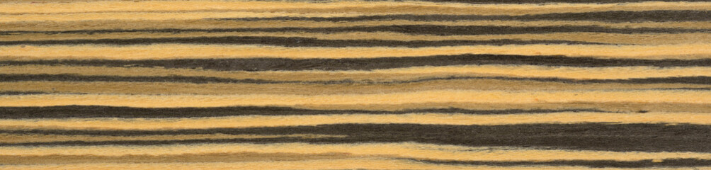 Wall Mural - Golden hues and dark streaks dance in harmony on the rich surface of this zebrawood veneer