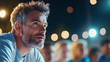 © lena - A man focuses on a lively event amid a crowd of engaged participants in the night