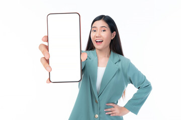 Beautiful Asian woman in a stylish green blazer holding a smartphone with a blank screen, smiling cheerfully and confidently, showcasing the phone towards the camera, isolated on a white background