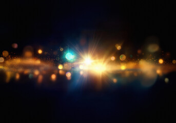 Leinwandbilder - Abstract background with a bright light and golden bokeh.