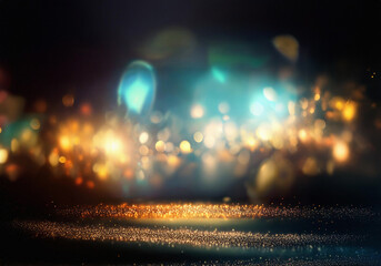 Poster - Abstract background with sparkling golden glitter and blurred lights in blue and yellow tones.