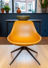 Canvas Print - Centered shot displays an ochre chair with dark metal base and light green ceramic bowl on it, set against a backdrop of blue walls, light wood