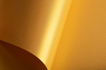 Leinwandbilder - Golden saffron paper background with a pearlescent, glossy texture and shimmering edges. Radiant honey tones and a sleek metallic sheen create a rich, elegant, and luxurious abstract design.