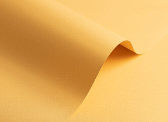 Fototapete - Golden yellow paper background with a smooth texture and subtle curves. Soft gradients and refined shadows create an elegant, sophisticated, and harmonious abstract composition.