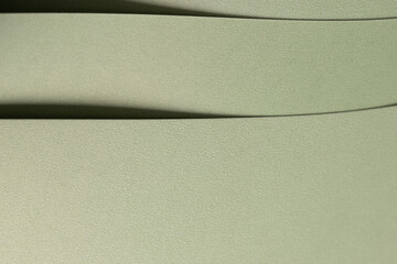 Aufkleber - Pastel sage green paper background with a soft texture and layered folds. Muted olive and moss tones create a refined, elegant, and minimal abstract design with subtle geometric lines.