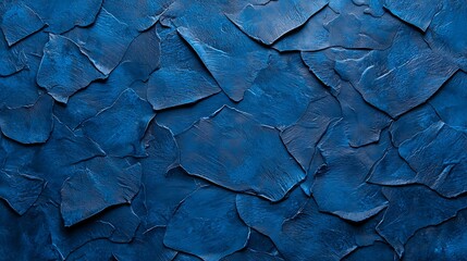 Wall Mural - A textured blue surface with irregular, overlapping pieces, creating a dynamic and visually appealing pattern.