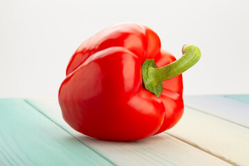 Wall Mural - bell pepper on blue wood background