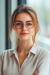 © Andrii  - Confident casual businesswoman in corporate environment