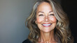 © Kevin - Elegant older woman with radiant smile and flowing wavy hair