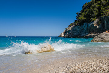 Wall Mural - The rocks of Cala Goloritze beach in Baunei in Europe, Italy, Sardinia, Baunei, in summer, on a sunny day.