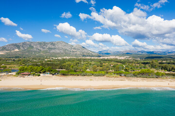 Wall Mural - The city seen from the beach in Orosei in Europe, Italy, Sardinia, Orosei, in summer, on a sunny day.