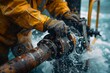 © S photographer - A worker operates industrial equipment in a challenging maritime environment.