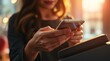 © organik - Close up shot of young woman paying contactless on a POS in a shop. She is using her phone.