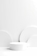 © Rysak - clean white cylindrical platform against a minimalist background