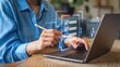 © Media Srock - Person completing a checklist on a laptop using a stylus