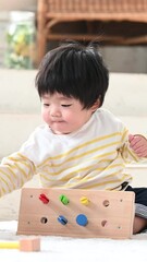 Sticker - 積み木で遊ぶ幼児の縦動画　子供の知育や発達、成長や育児や子育てのイメージ　クローズアップ