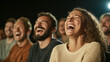 © pattozher - Joyful Audience: A diverse group of people burst into hearty laughter during a live performance, capturing the essence of shared amusement and contagious glee.
