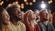 © pattozher - Joyful Audience: A diverse group of people laugh wholeheartedly, illuminated by a spotlight, capturing the infectious energy of shared laughter, perfect for conveying happiness.