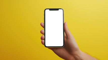 Wall Mural - A mockup of a trendy black phone with an empty white screen on a yellow background. Close-up of a man holding a new cell phone in his hand for the presentation of a mobile application