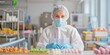 © WeeraWanderlust - A worker in a food factory wearing full protective gear, including gloves, mask, and hairnet
