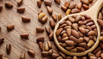 Fototapete - Background featuring pine nuts texture, highlighting their smooth surface and creamy beige color. Perfect for healthy snacks, baking, or natural food themes. Texture, background.