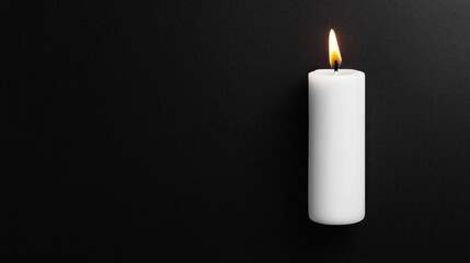 Poster - Single White Candle with Flame Against Black Background