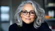 © bcendet - Smiling older woman with gray hair wearing glasses in home, beauty ad possible