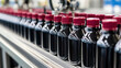 © praewpailyn - Bottled juices on production line, showcasing quality control and inspection. vibrant colors and sleek design highlight manufacturing process