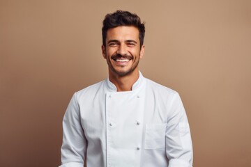 Wall Mural - Male chef smiling adult smile.