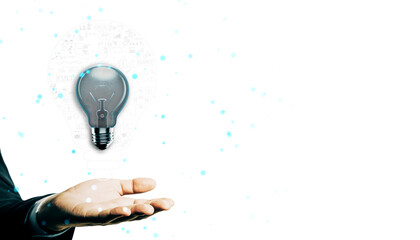 Wall Mural - Businessman’s hand holding a glowing lightbulb with digital elements on a white background, representing creativity, ideas, and innovation