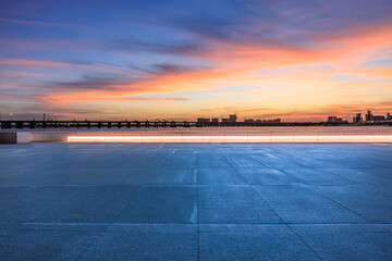 Wall Mural - Empty square floor and coastline with sky clouds natural landscape at sunset