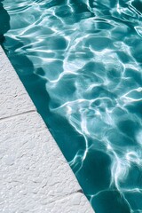 Wall Mural - an overhead view of the edge of an in-ground pool with white and gray tiles, light blue water